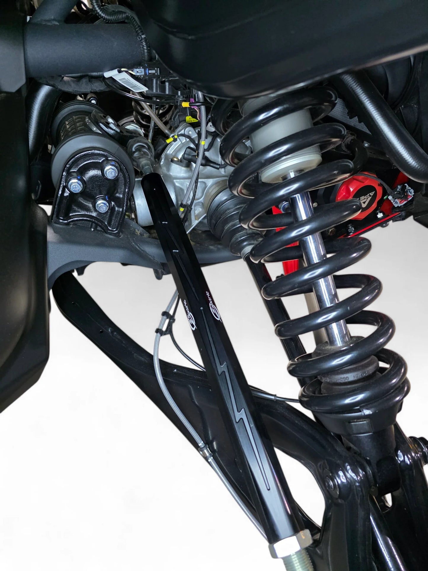 Close-up of a motorcycle suspension system on a white background
