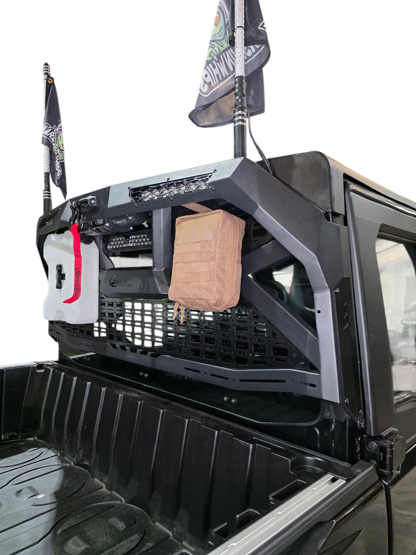 Truck bed with storage compartments and equipment, including a bag and a box.