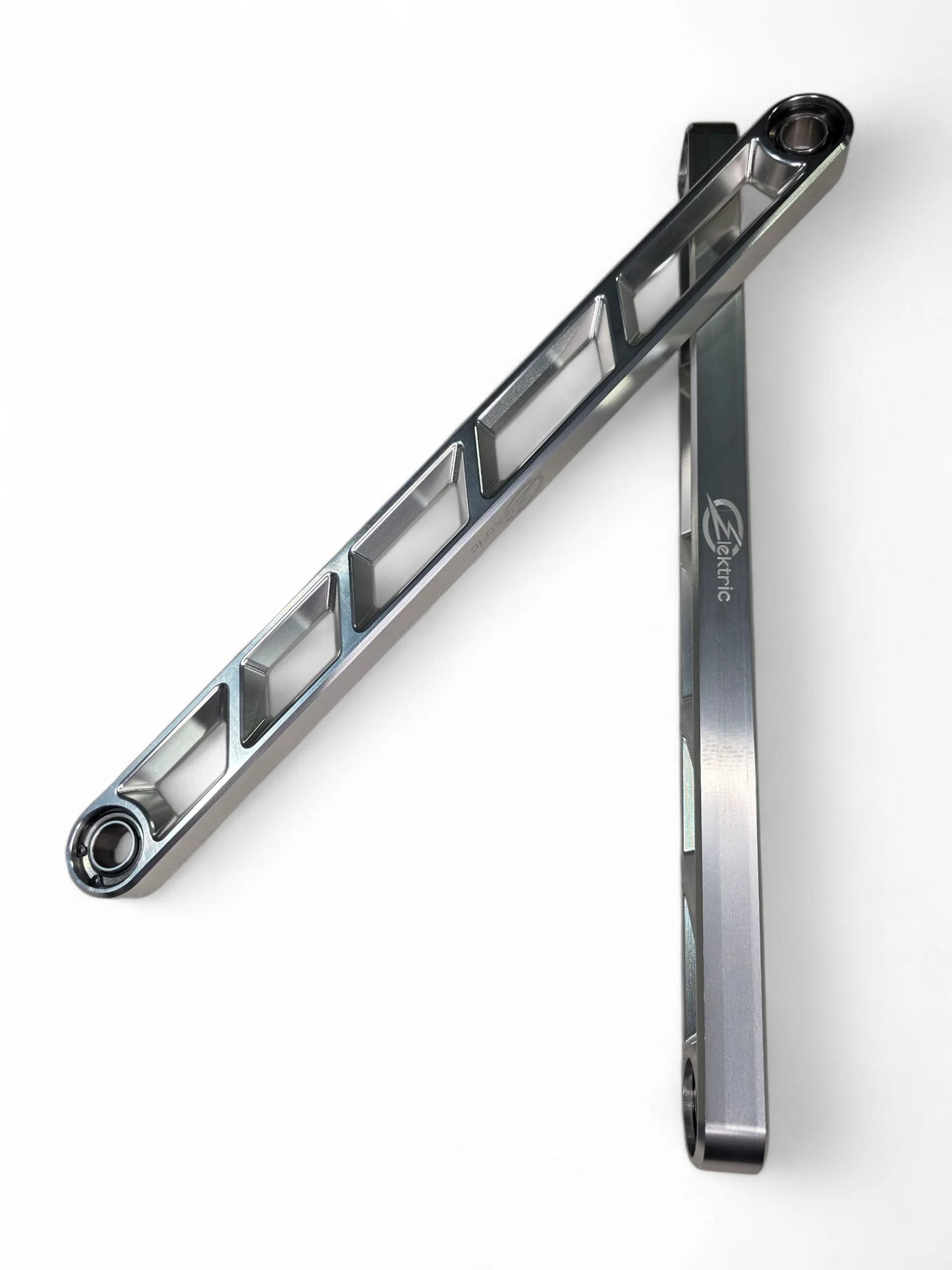 Metallic tool or component on a white background