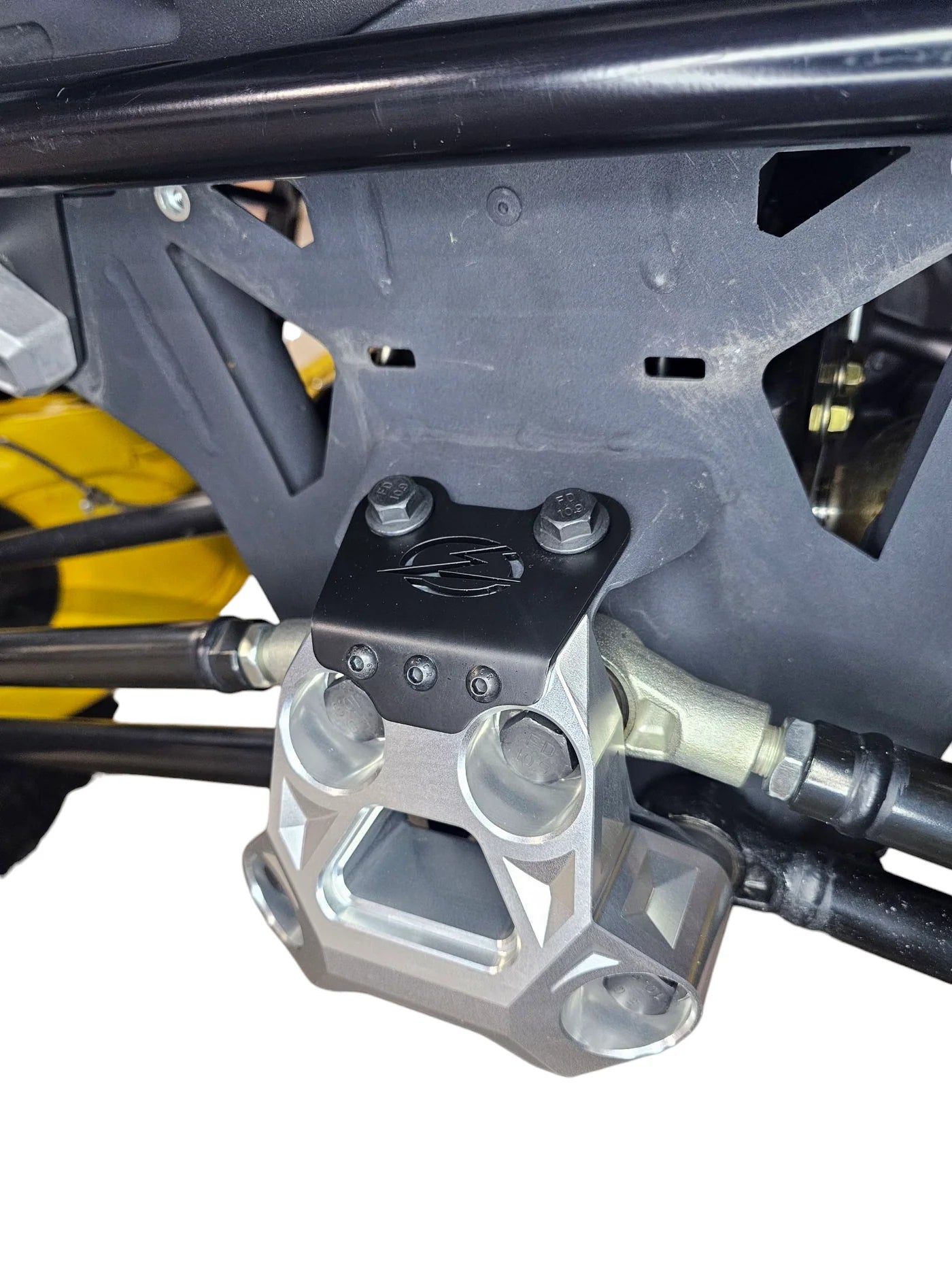 Close-up of a mechanical component on a vehicle with visible branding.