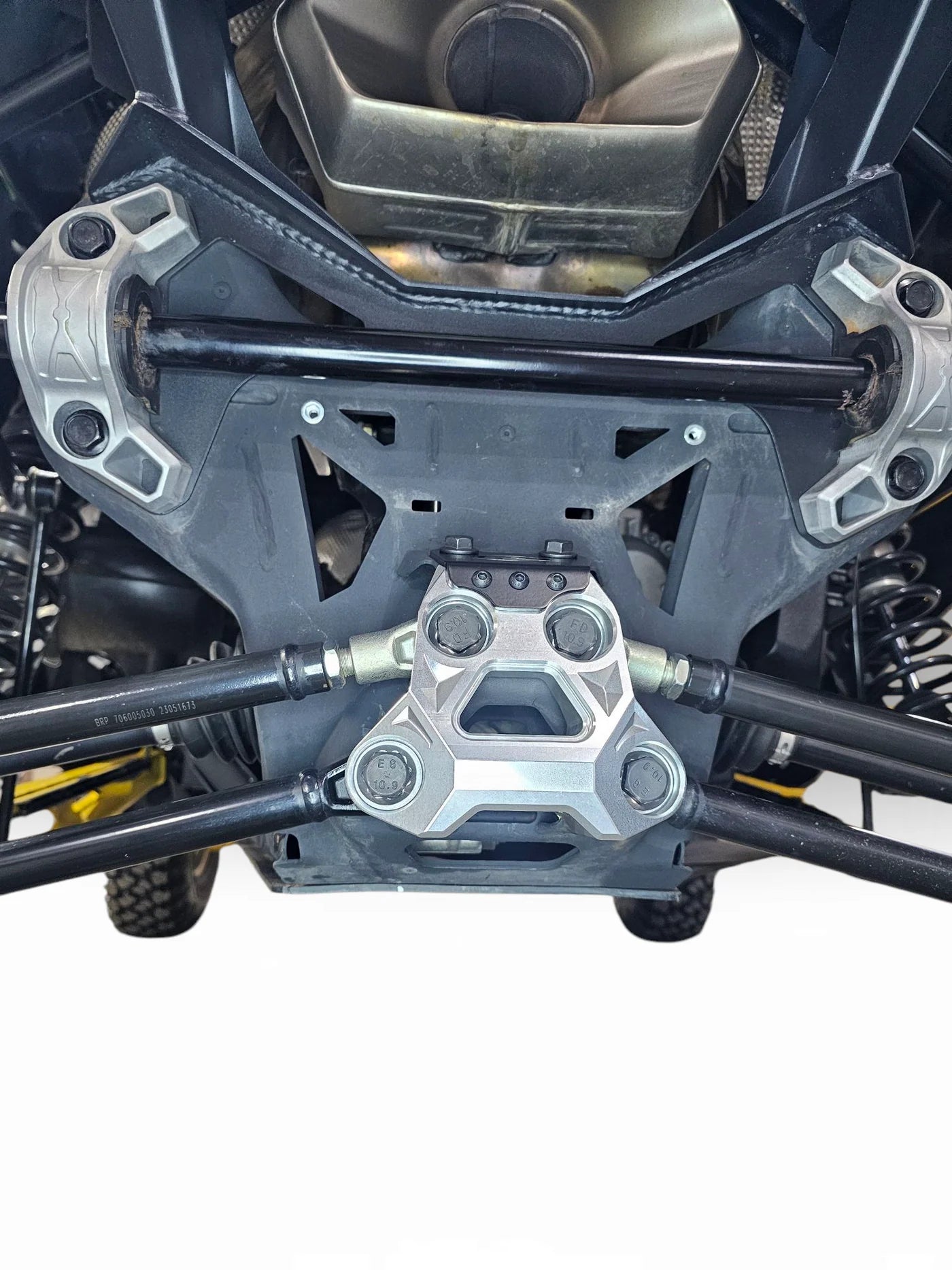 Close-up of a motorcycle's suspension system with metal components.