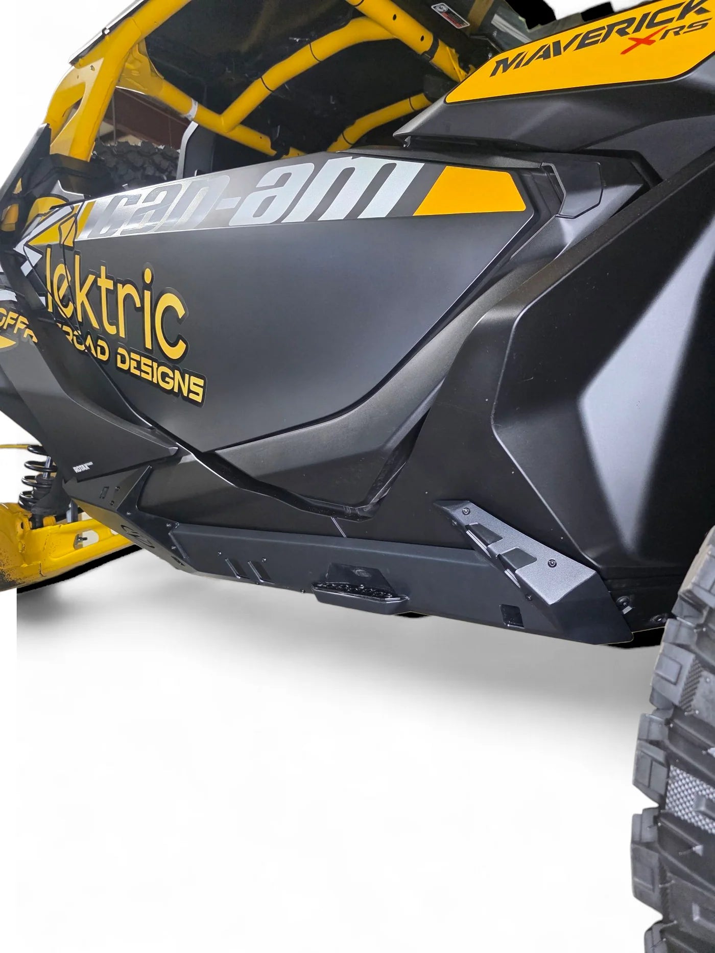 Close-up of a black and yellow electric vehicle with 'Elektric' branding on a white background