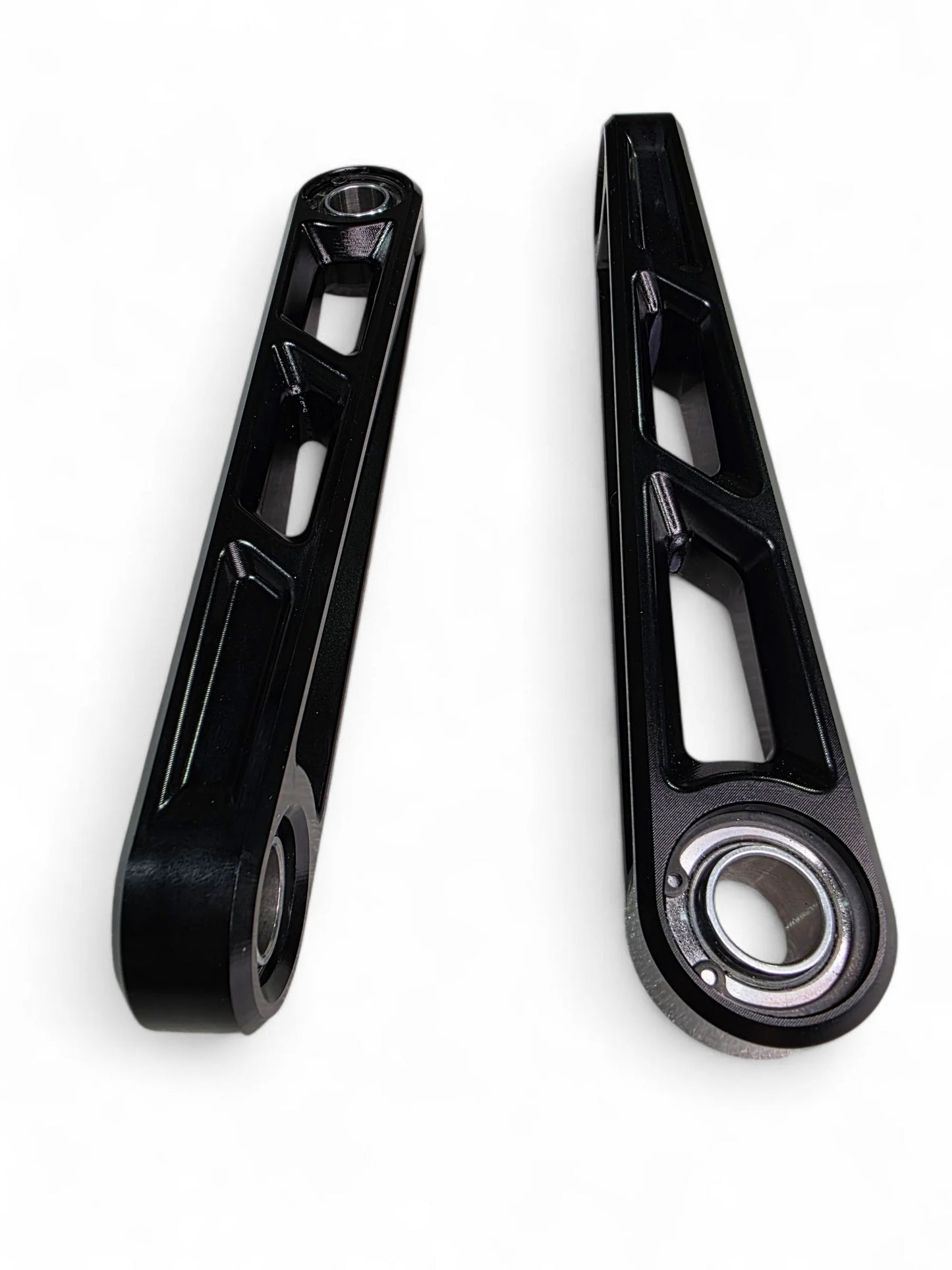 Two black metal connecting rods on a white background