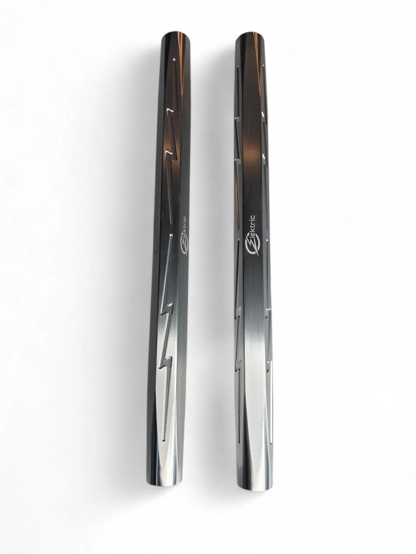 Two metallic objects with a reflective surface on a white background