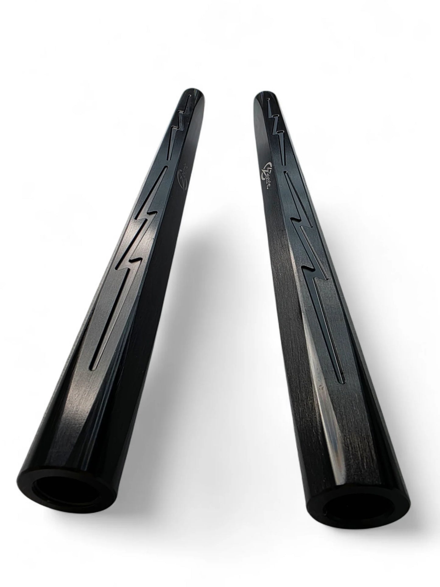 Two black luminum components on a white background