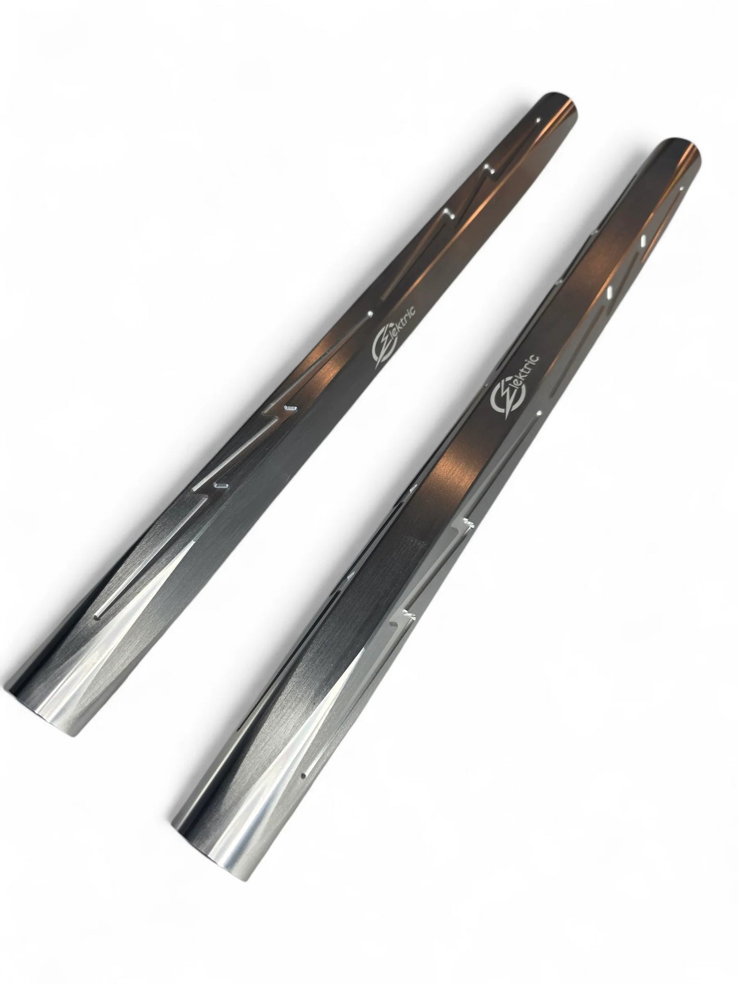 Two metallic objects with a reflective surface on a white background