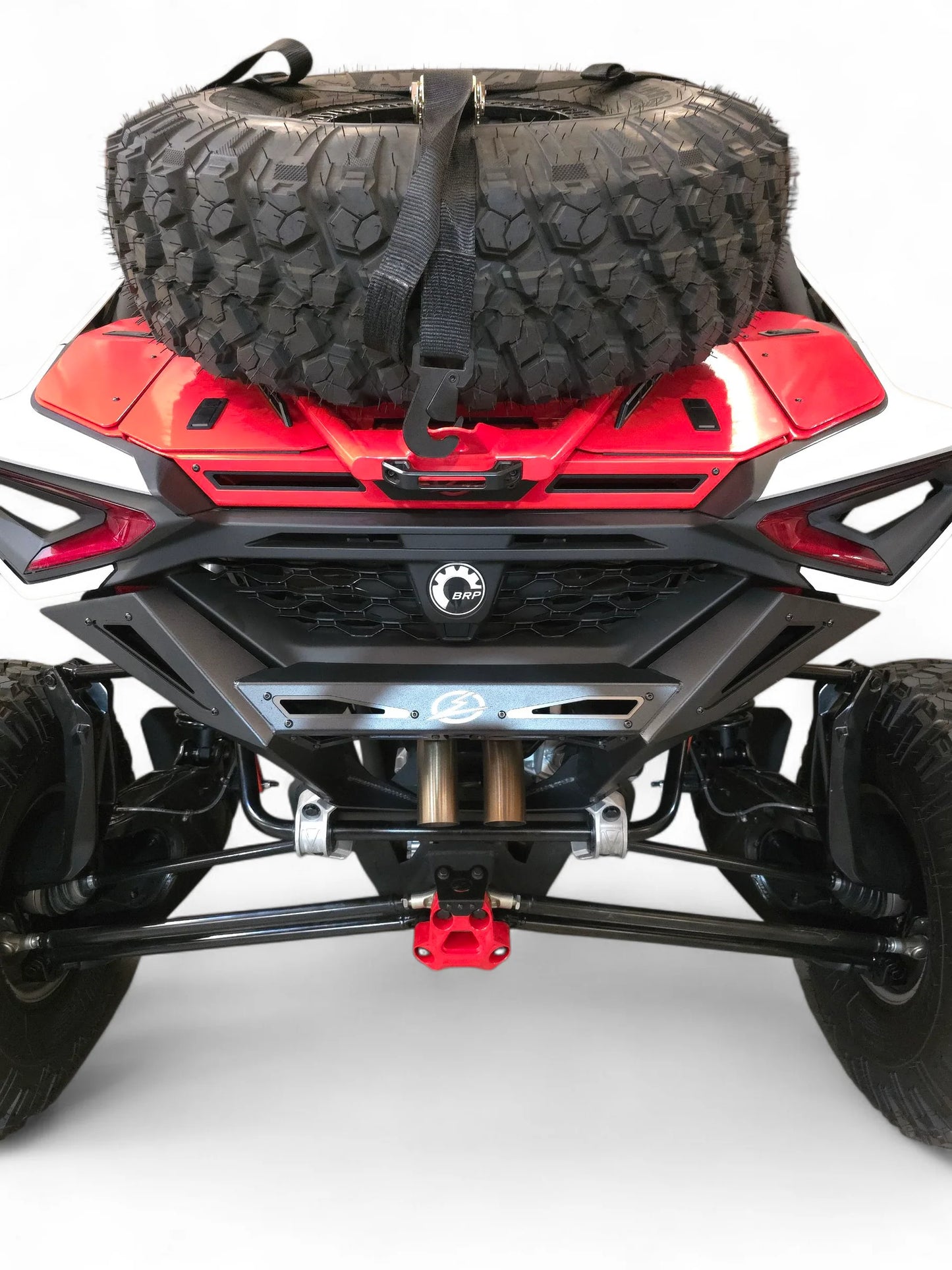 Red off-road vehicle with a black tire and bag on a white background