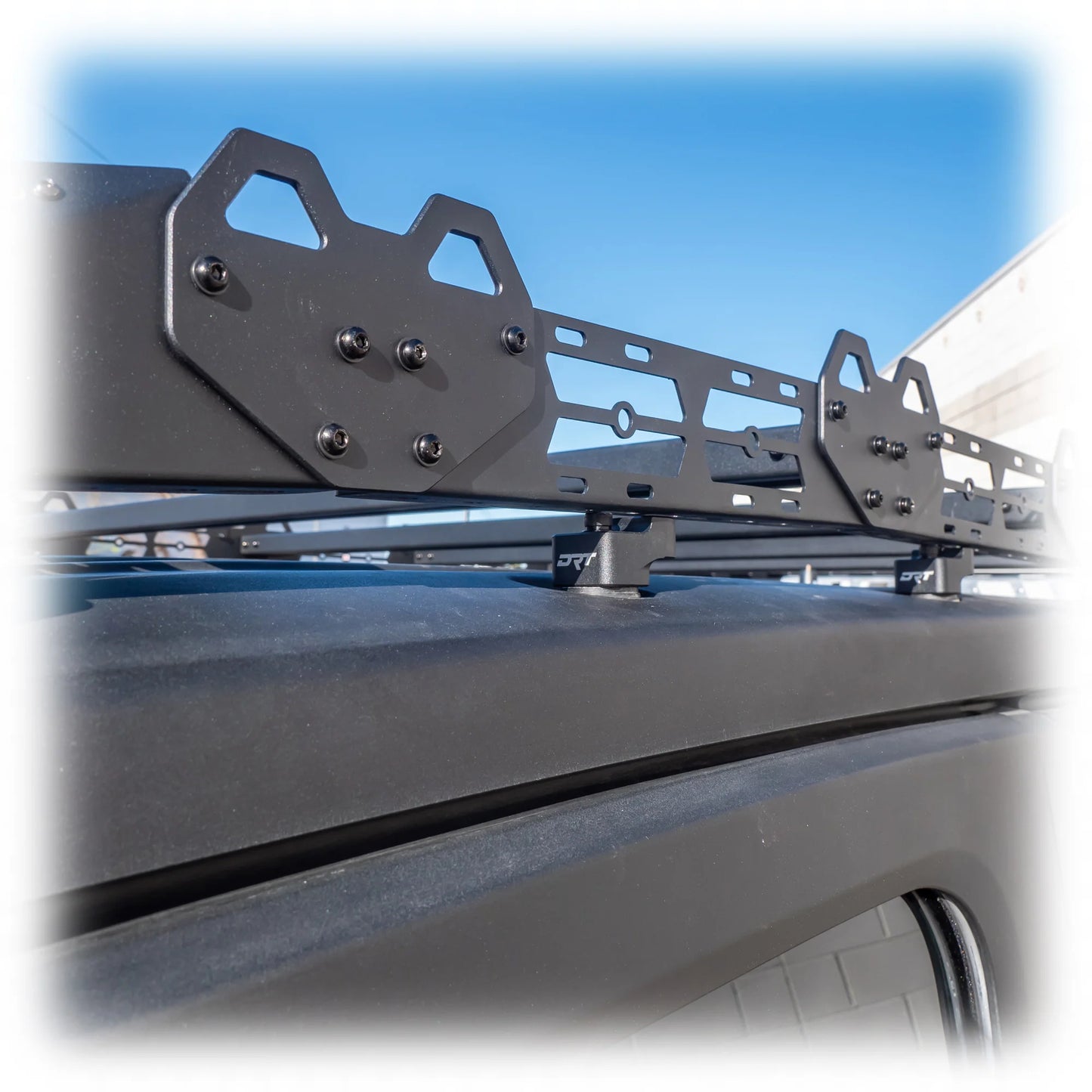 Roof rack system on a vehicle with a clear blue sky background