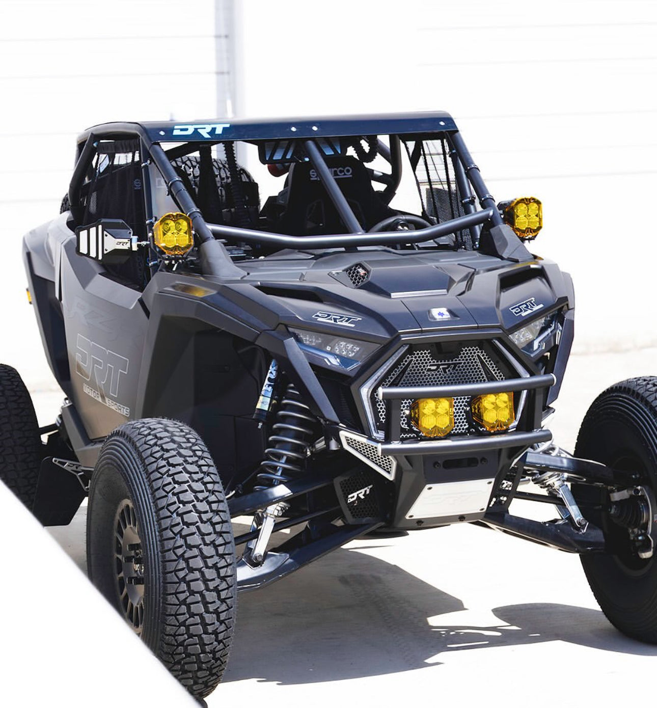 Gray off-road vehicle with yellow lights on a white background