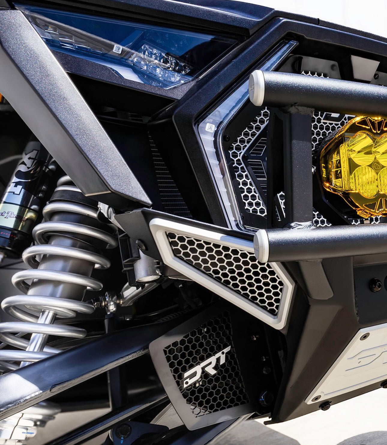 Close-up of a vehicle's front bumper and grille with 'PRT' branding.