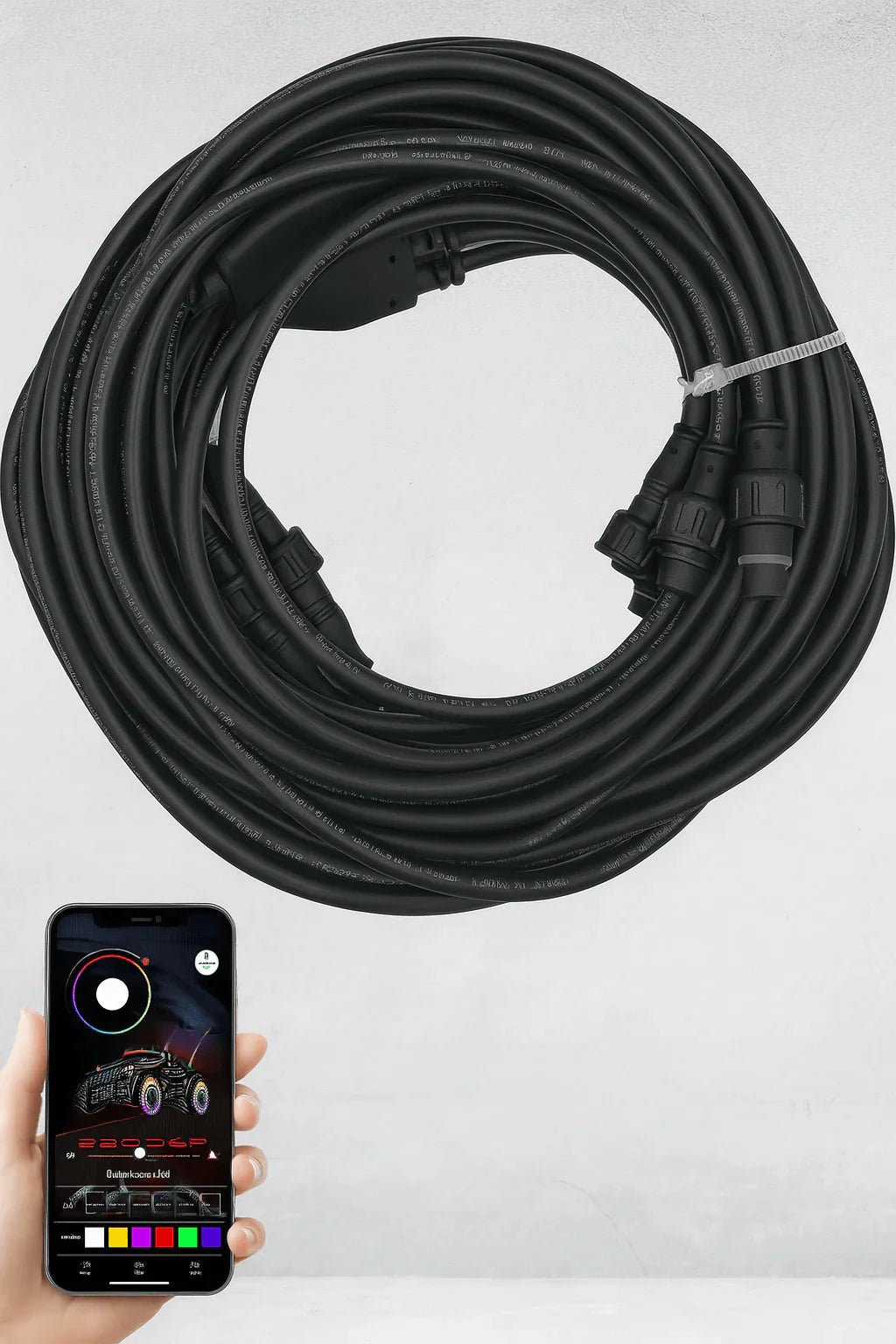 Coiled black cable with a smartphone displaying a color selection app on a white background