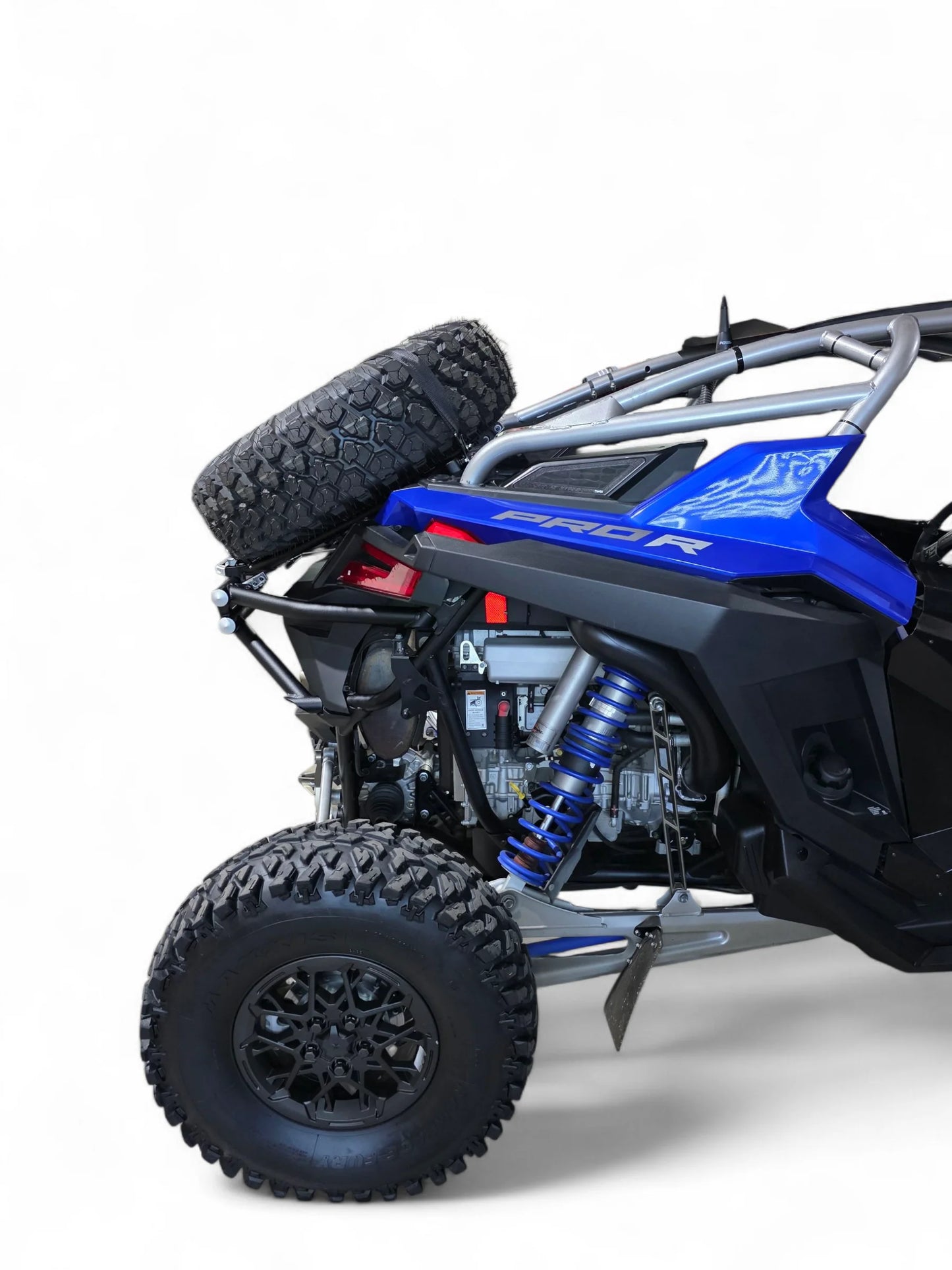 Blue and black off-road vehicle with large tires on a white background