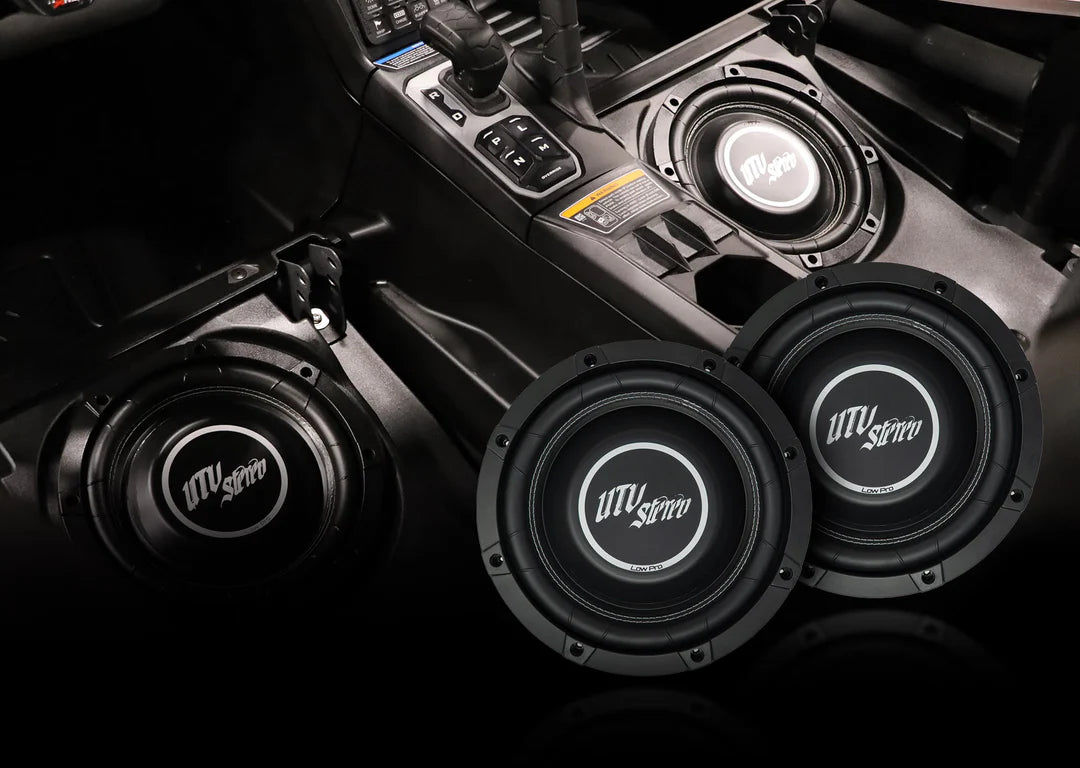 Car audio system with subwoofers and a visible brand logo on a dark background
