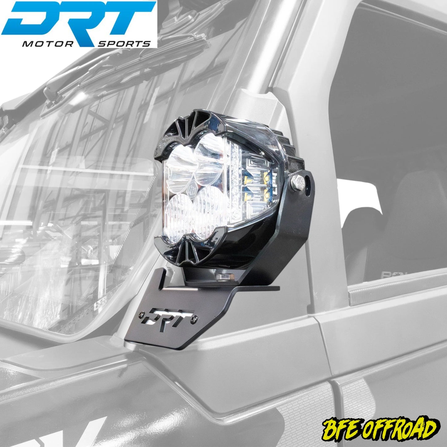 Off-road vehicle light mount with DRT Motor Sports branding on a vehicle.