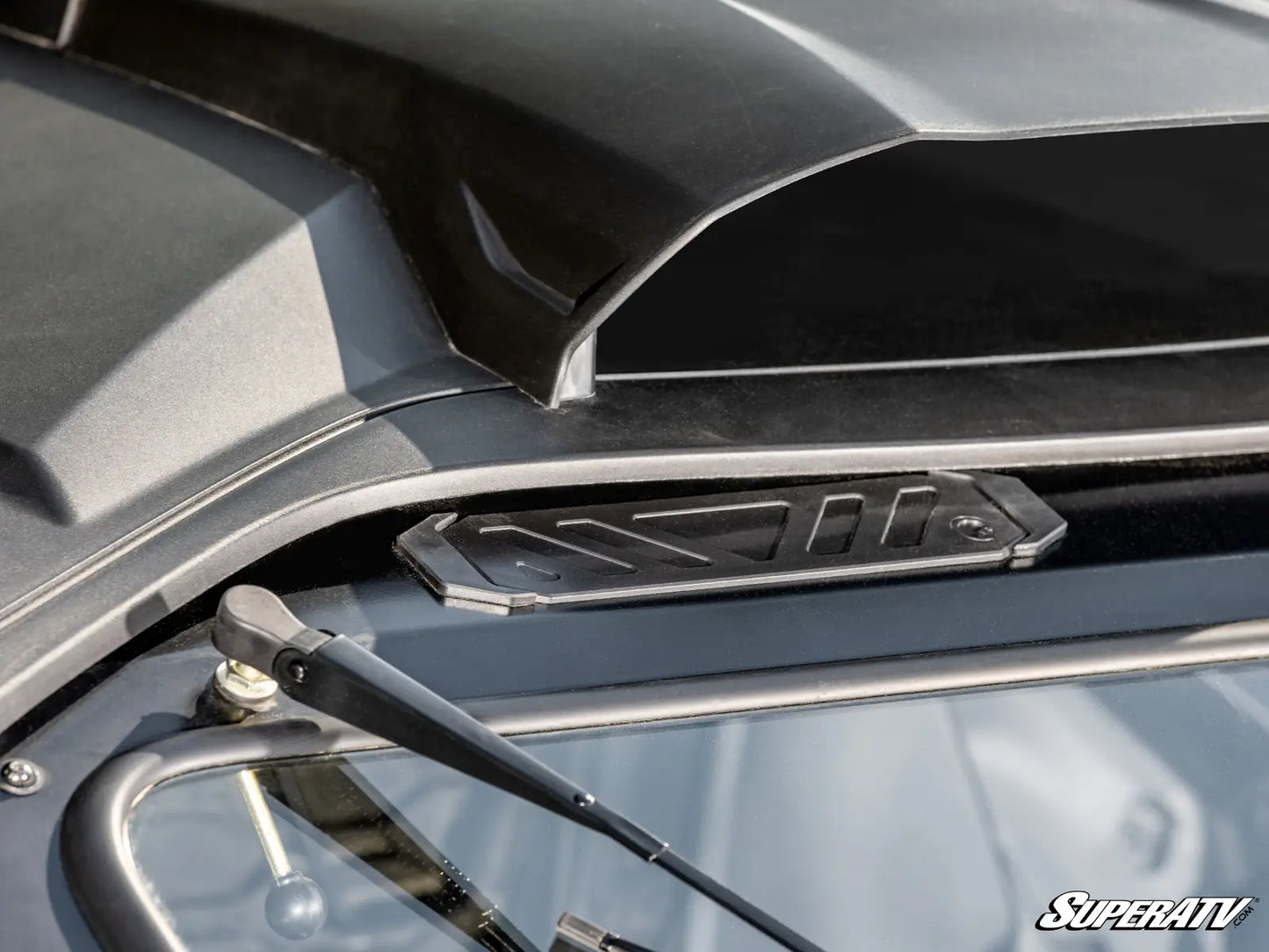 Close-up of a motorcycle with a SuperATV logo on the side