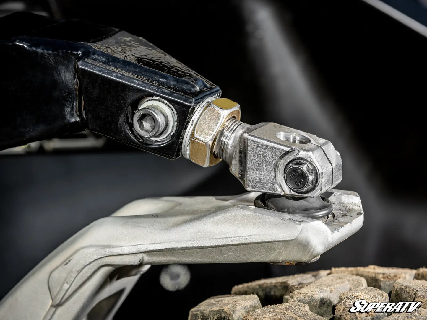 Close-up of a metal bracket with bolts on a SuperATV product.