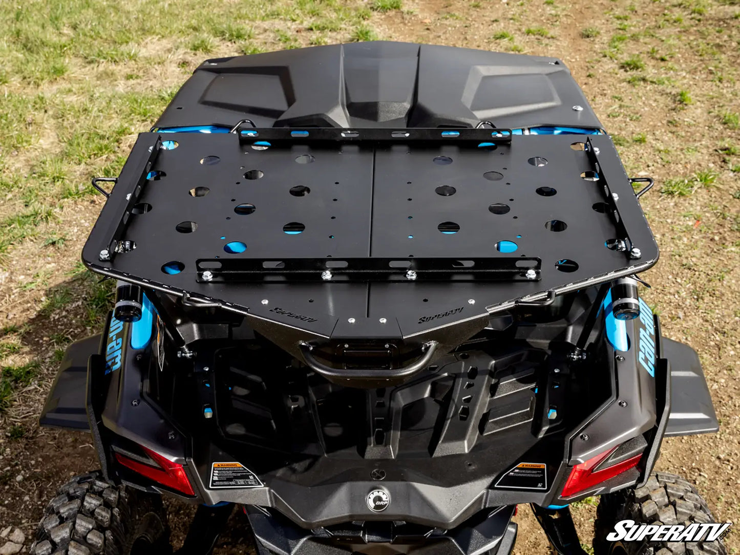 Black roof rack system on a SuperATV vehicle in an outdoor setting