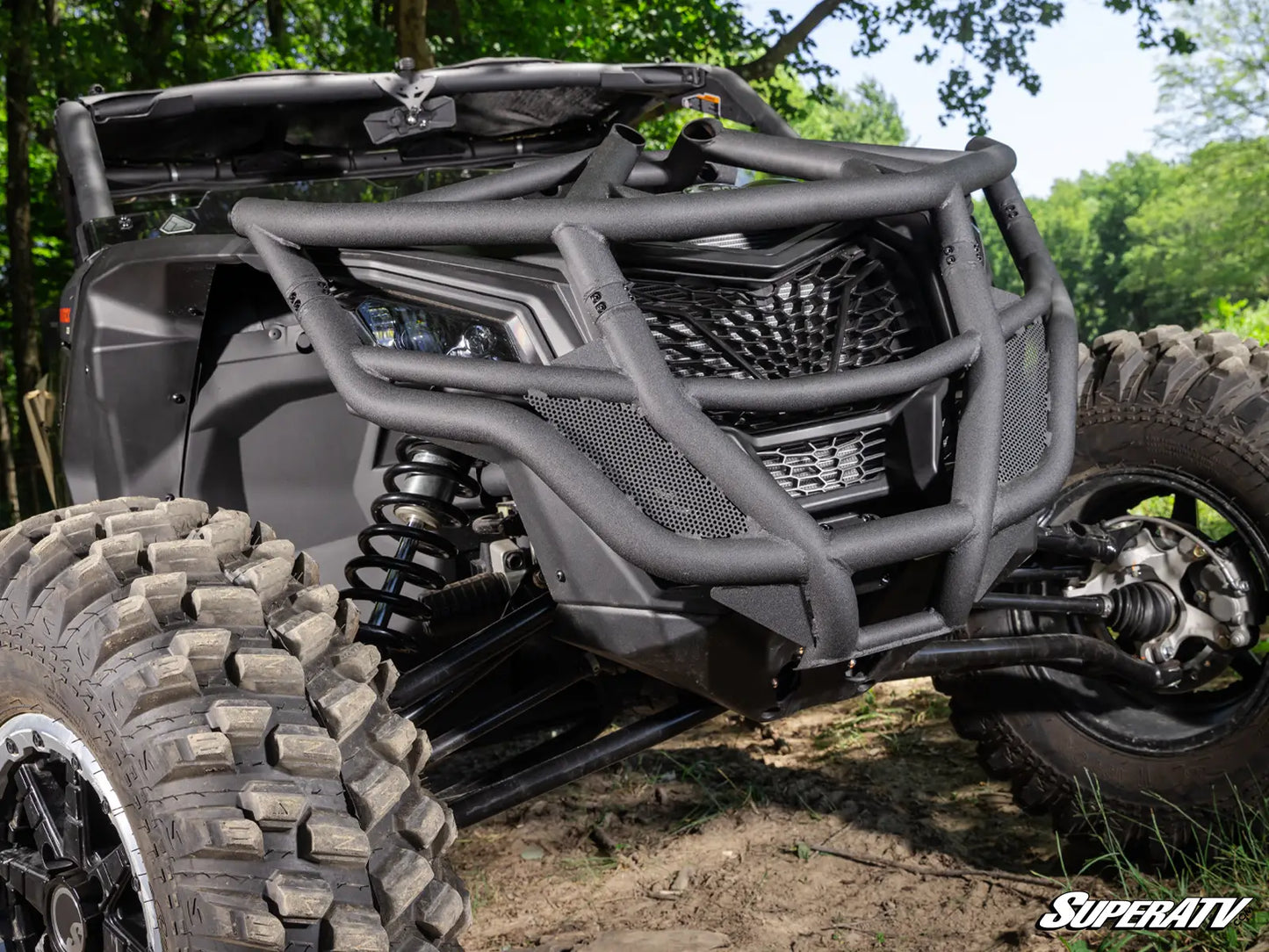 ATV with large tires and protective bumper in a natural setting