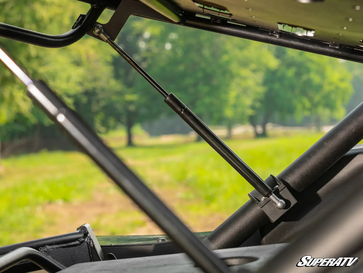 Close-up of a SuperATV product with a blurred natural background