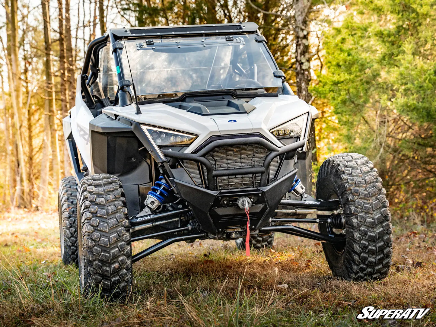 SuperATV off-road vehicle in a forest setting