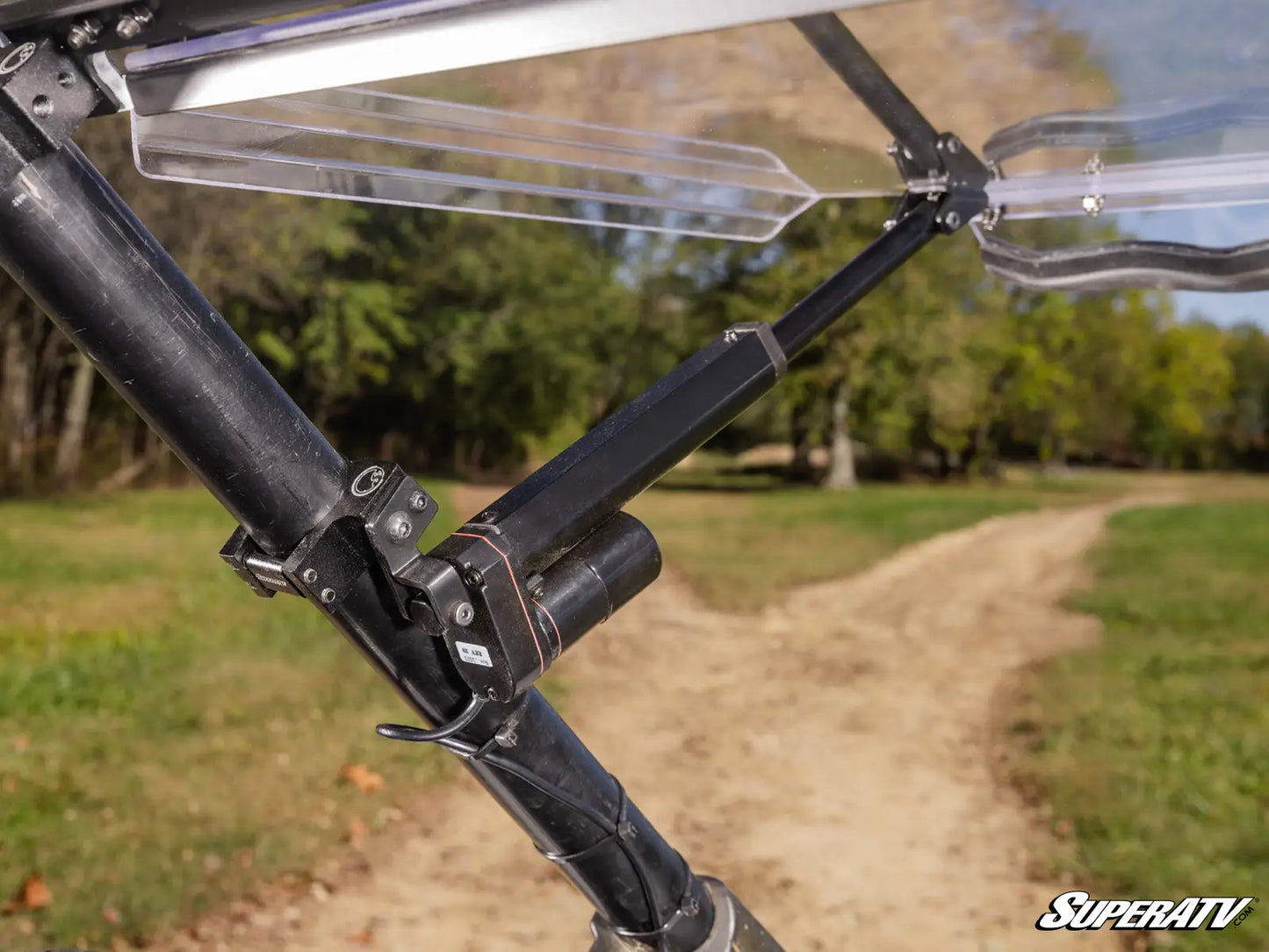Close-up of a SuperATV product with a blurred natural background