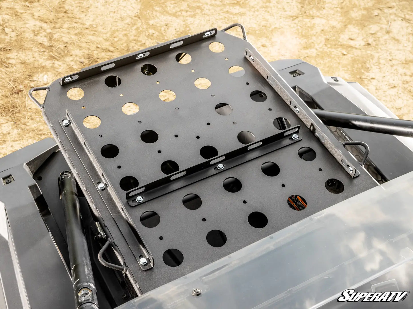 Metal mounting bracket with multiple holes on a SuperATV branded vehicle
