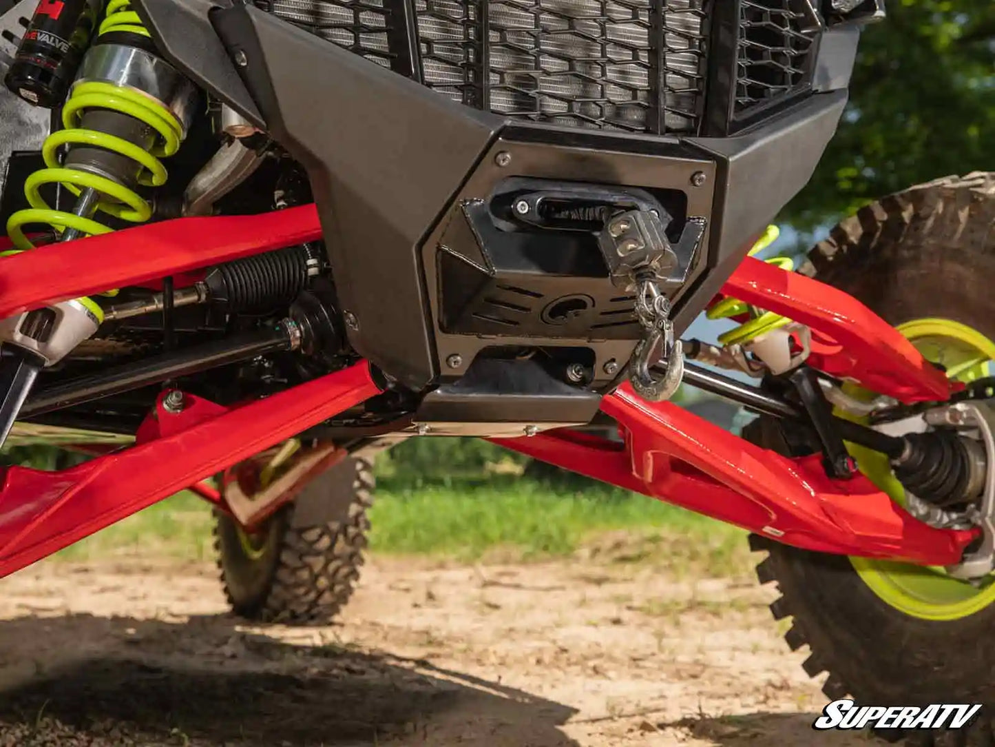 Close-up of a red and black ATV with visible SuperATV branding.