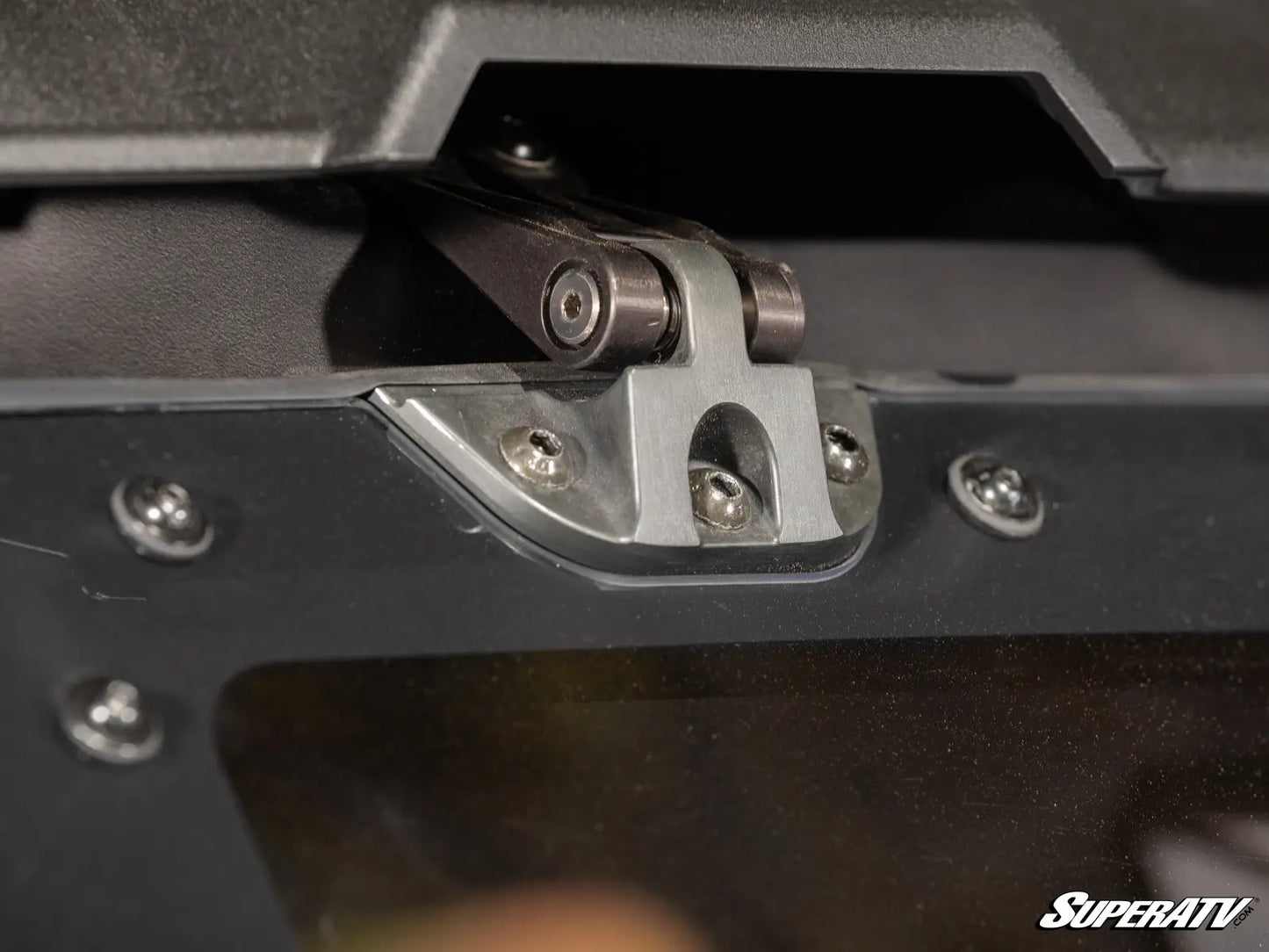 Close-up of a metal hinge on a SuperATV product