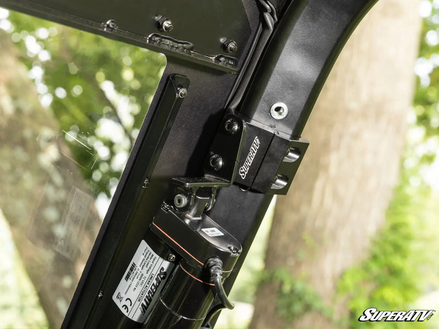 Close-up of a SuperATV product with a blurred natural background