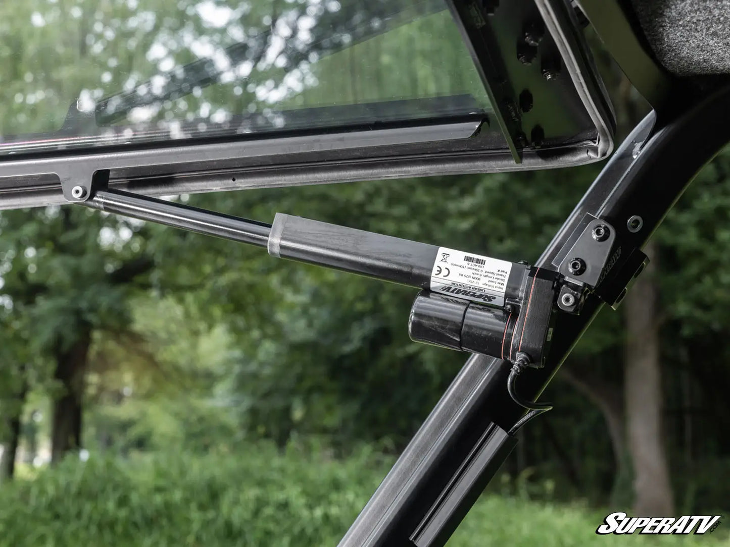 Close-up of a SuperATV product with a blurred natural background