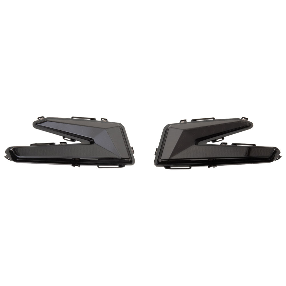Two black car taillights on a white background
