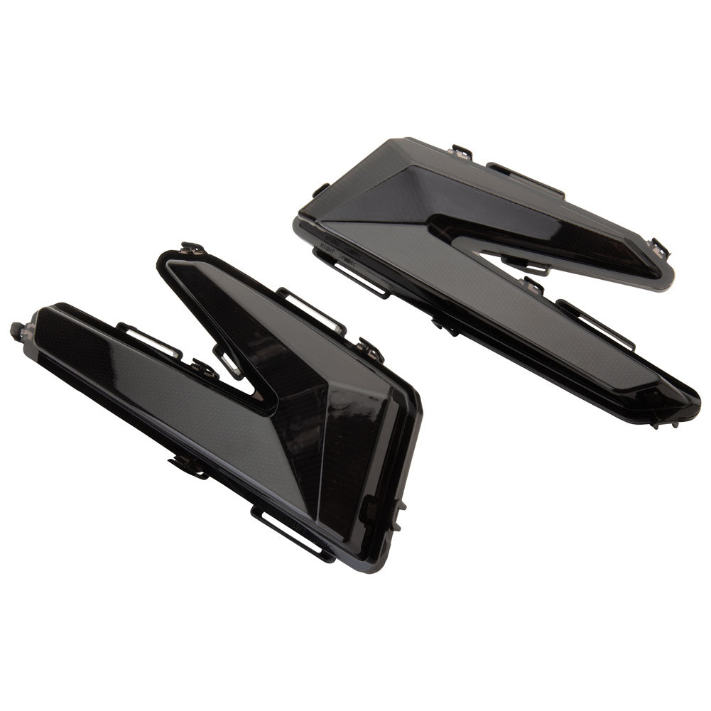 Two black motorcycle lights on a white background