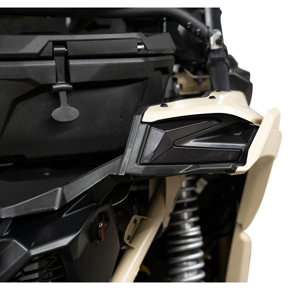 Close-up of a motorcycle's side mirror and part of the frame on a white background