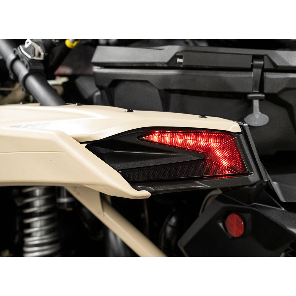 Close-up of a motorcycle's taillight and rear section.
