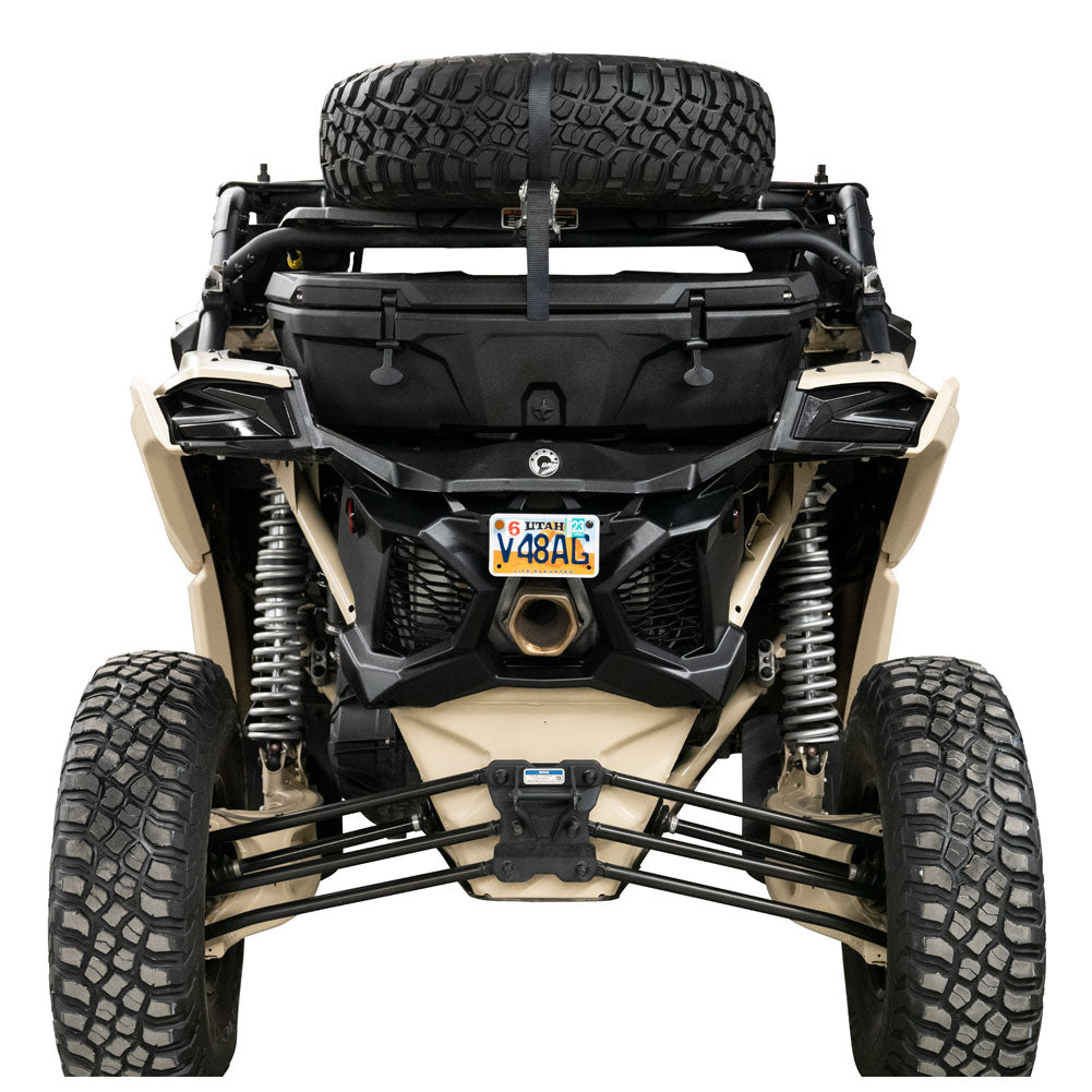 Front view of an off-road vehicle with a spare tire on a white background
