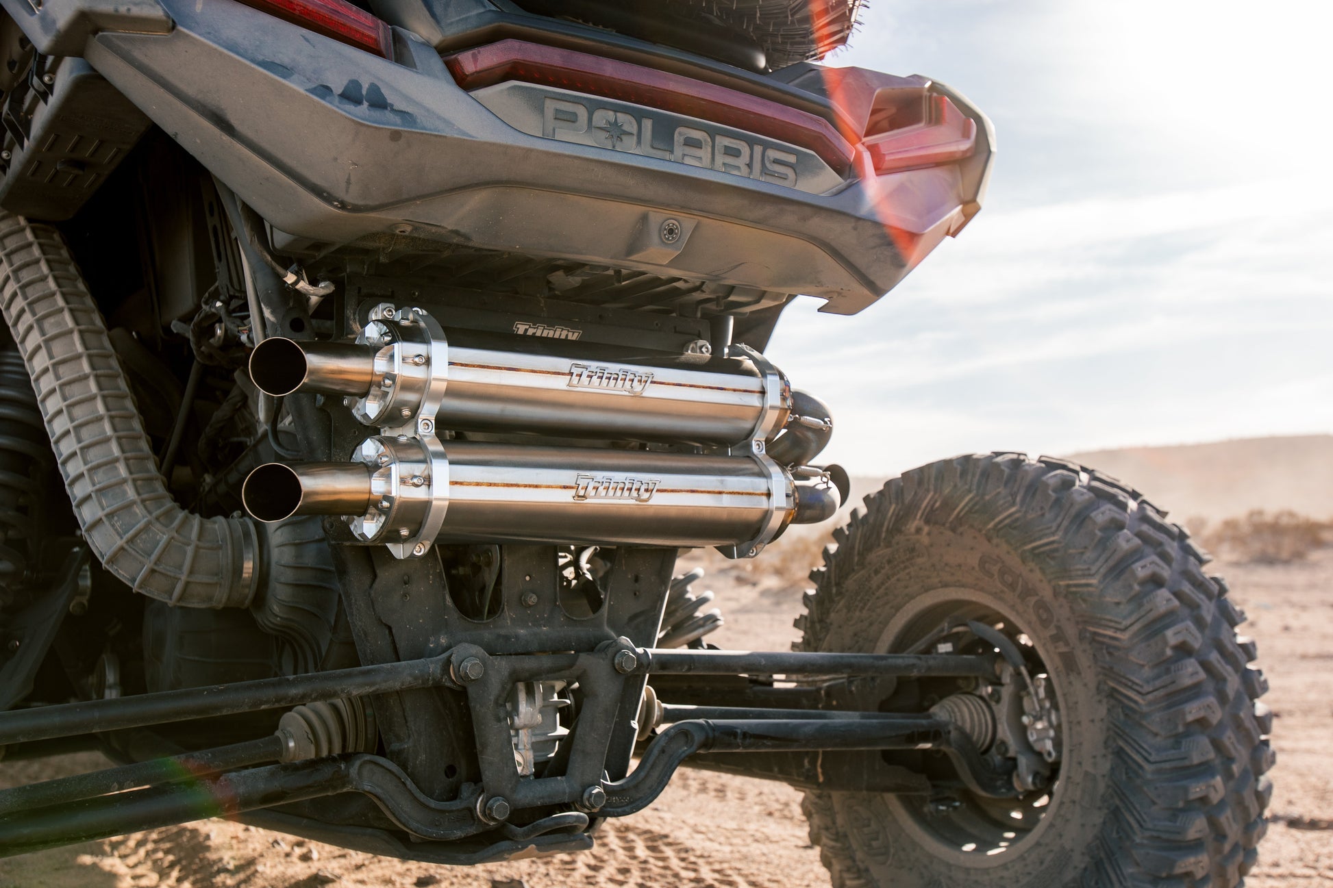 Trinity Racing Stainless Steel RZR PRO XP TURBO R SLIP ON on machine in desert