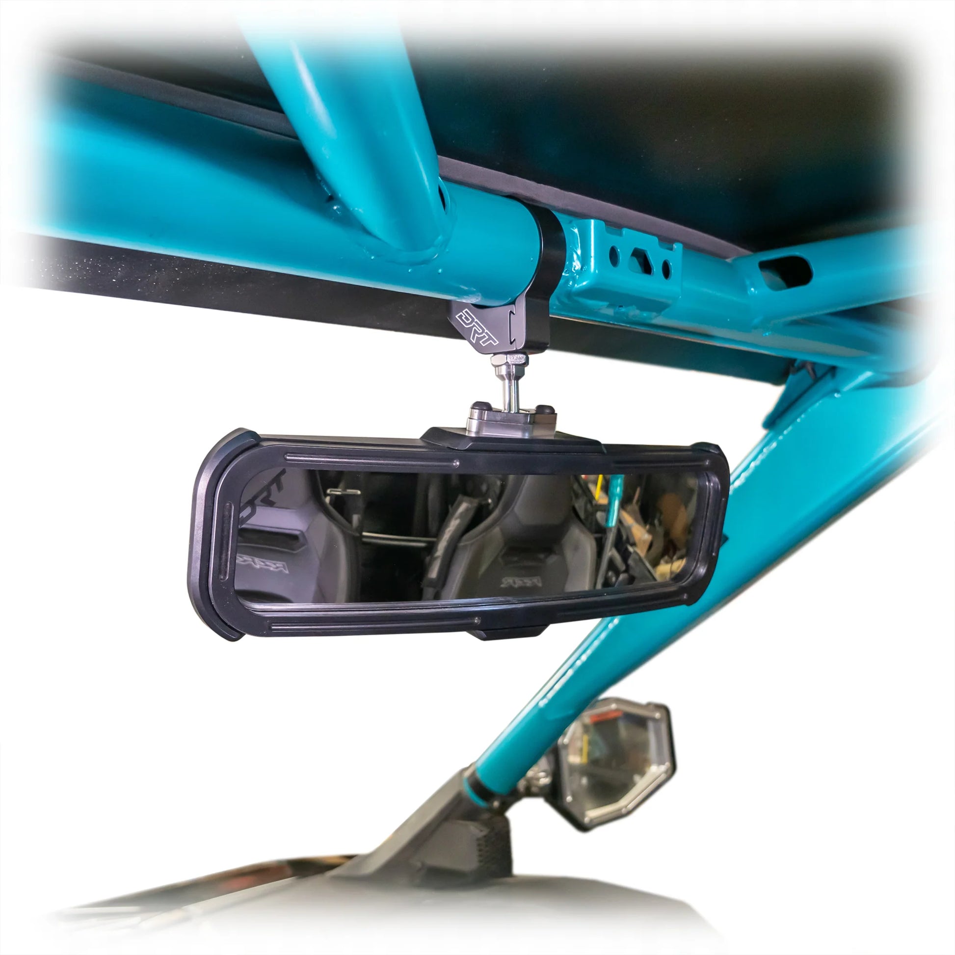 Close-up of a motorcycle mirror attached to a teal bike frame.