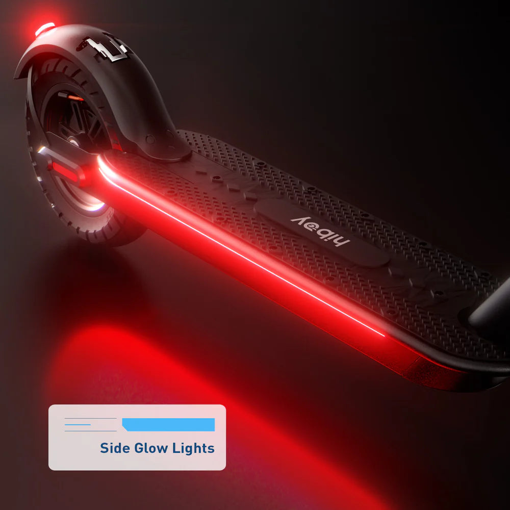Black scooter with red side glow lights on a dark background