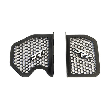 Two black protective guards with honeycomb design and 'DRT' branding on a white background