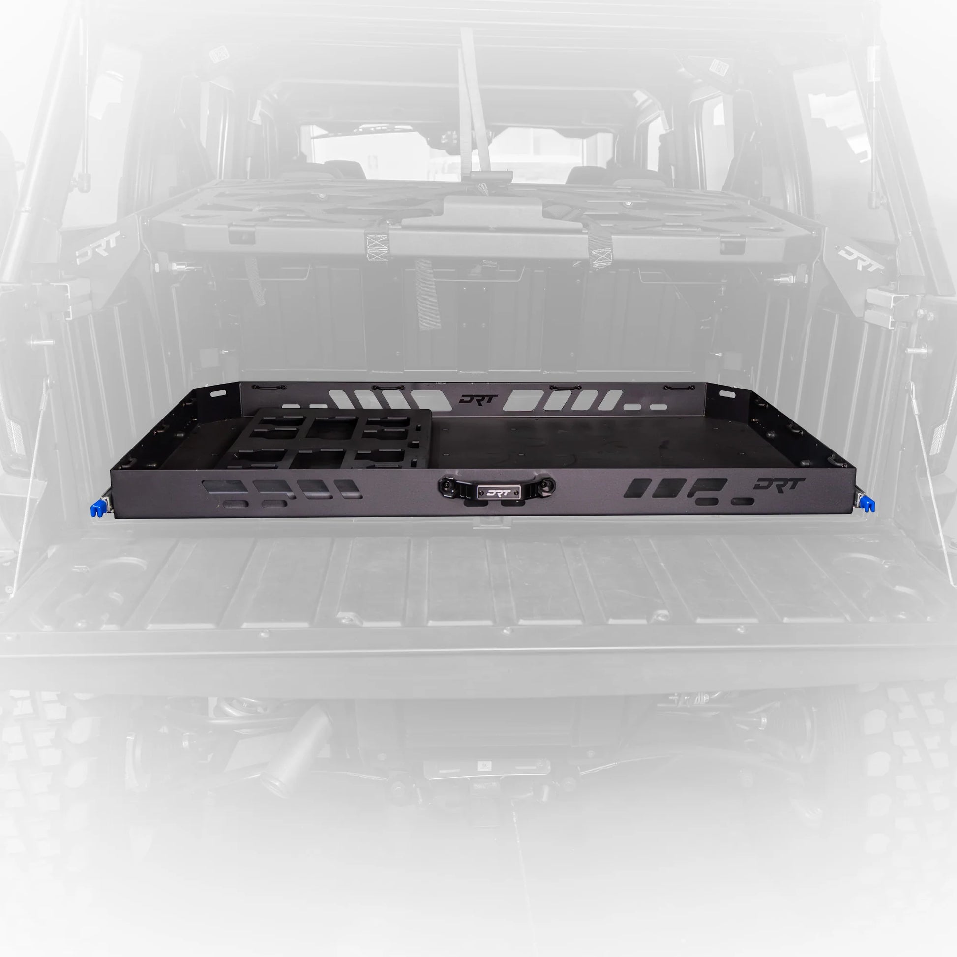 Black metal shelf or rack inside a vehicle with visible branding on a white background