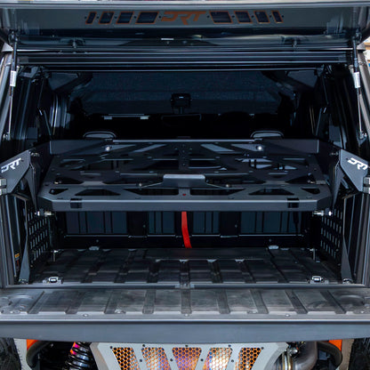 Open cargo area of a vehicle with a black storage rack.