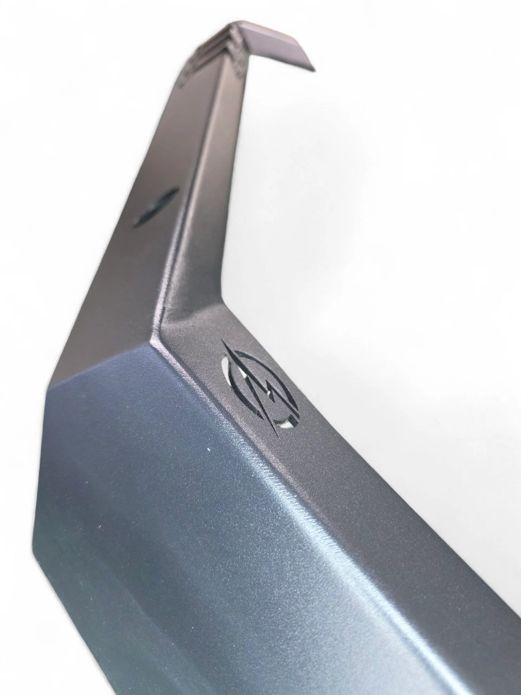 Metallic car fender with a logo on a white background