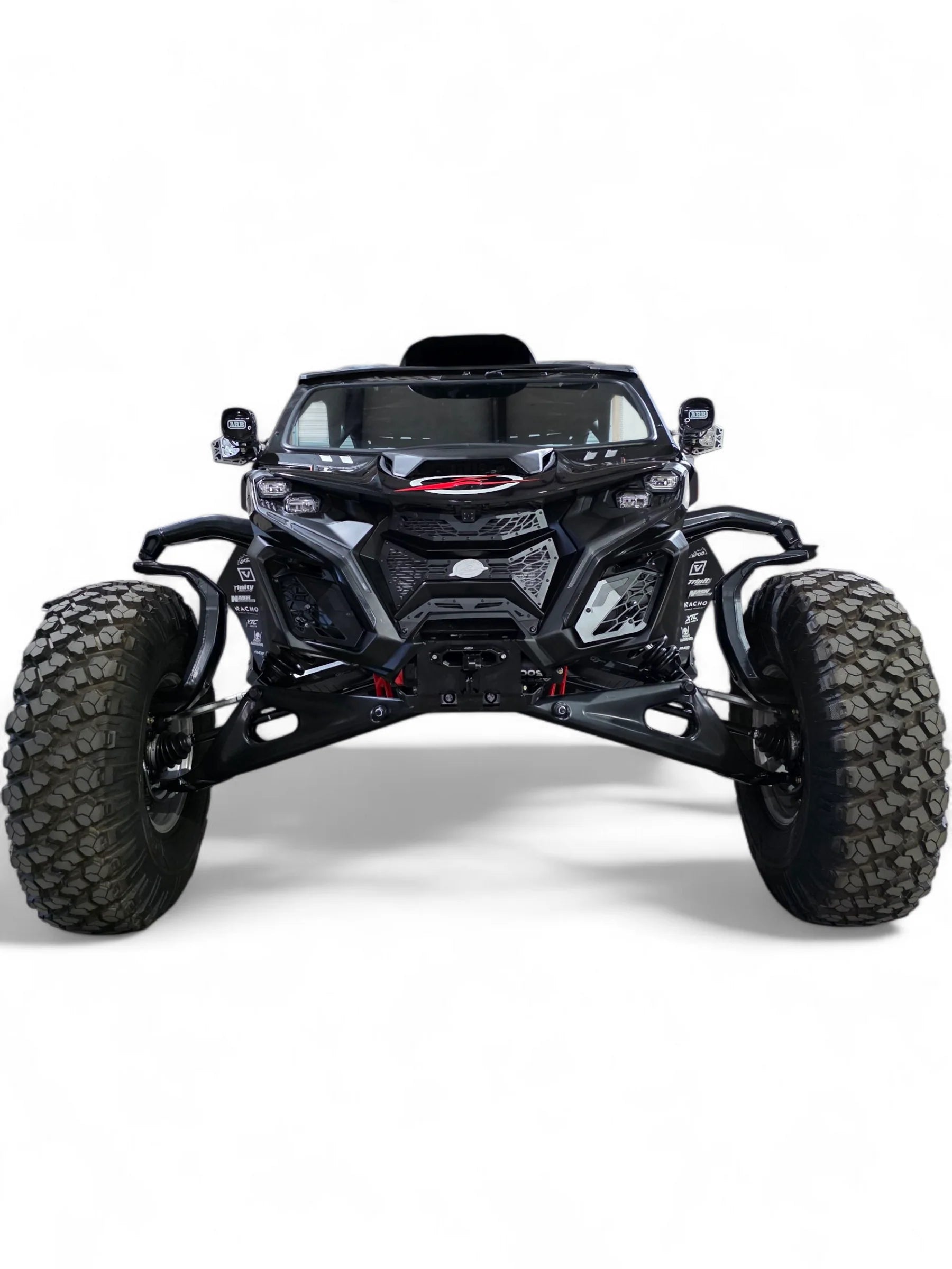 Black off-road vehicle with large tires on a white background
