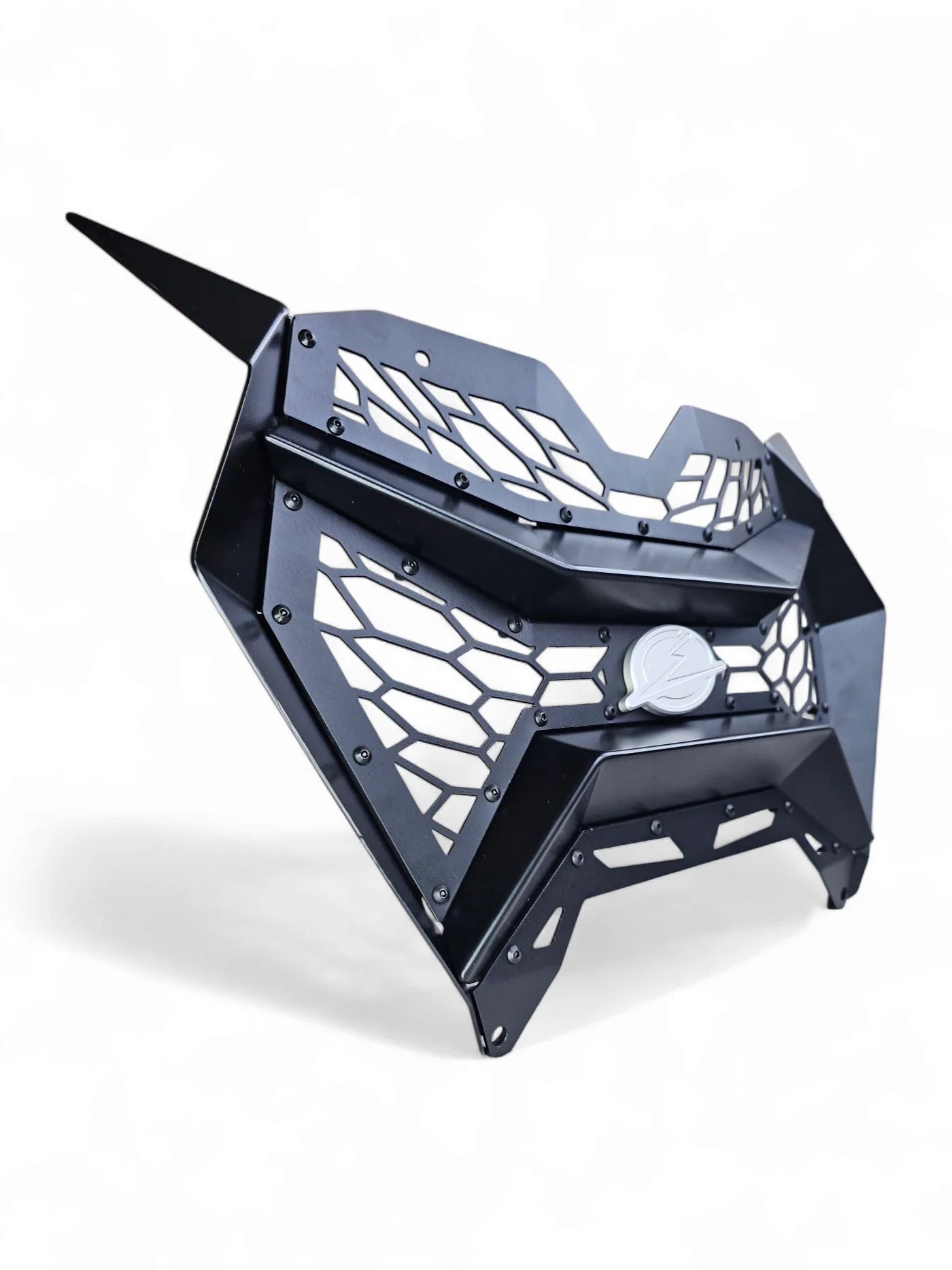 Black metal grill with geometric design on a white background