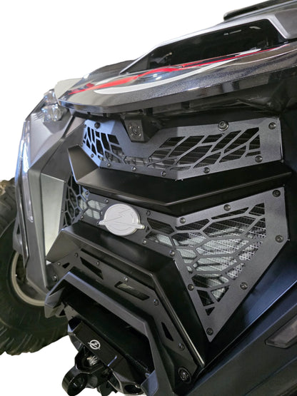 Close-up of a vehicle's front bumper with a detailed grille design on a white background