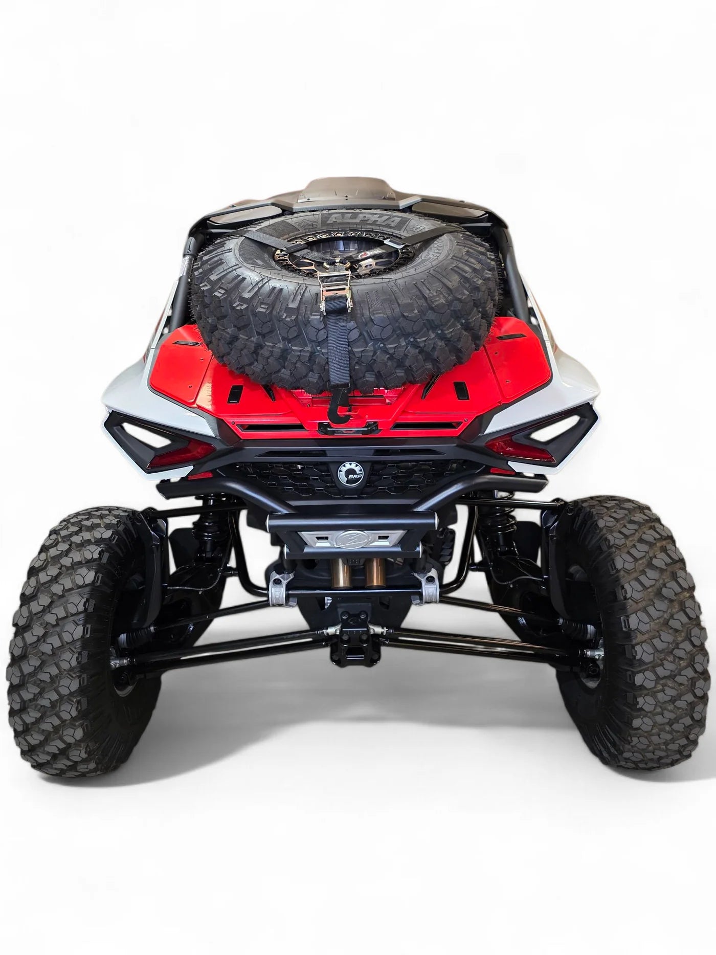 Back view of a red and black off-road vehicle on a white background