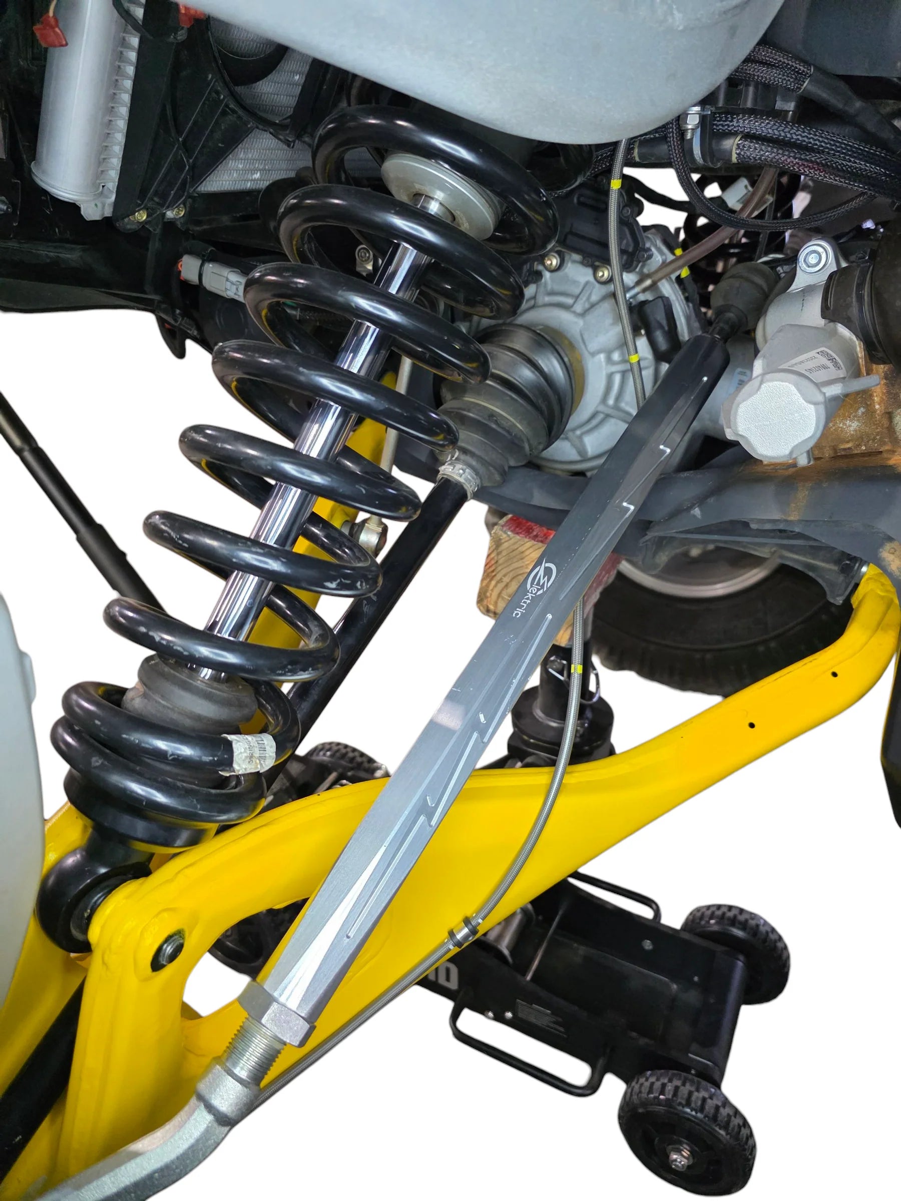 Close-up of a motorcycle suspension system with springs and shock absorber on a white background