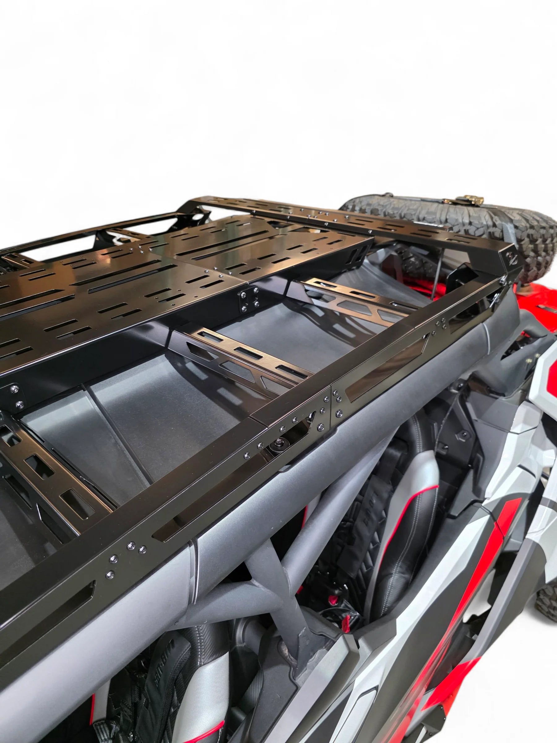 Close-up of a motorcycle with a black luggage rack on a white background