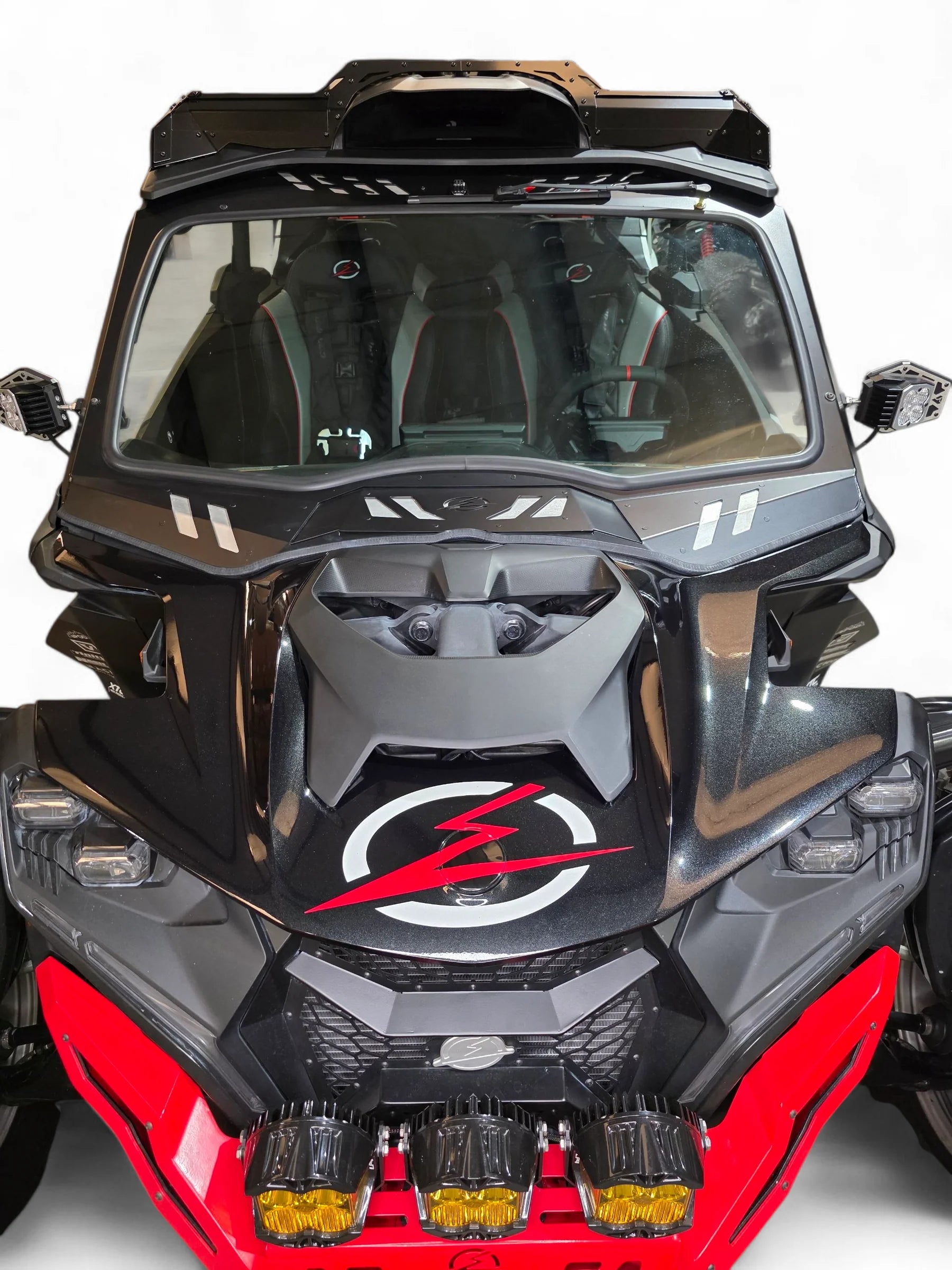 Front view of a black and red off-road vehicle with a clear windshield.