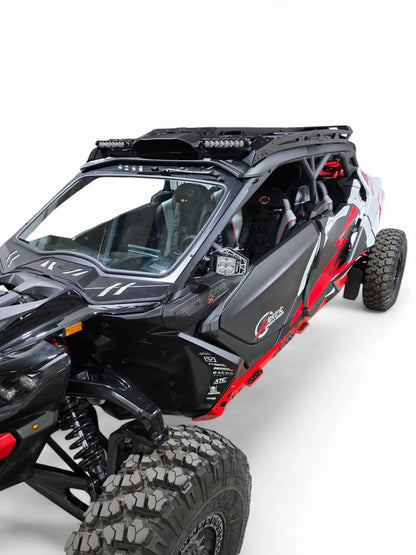 Black and red off-road vehicle with roof rack on a white background